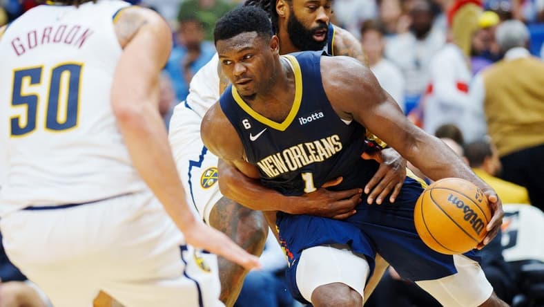 Dec 4, 2022; New Orleans, Louisiana, USA; New Orleans Pelicans forward Zion Williamson (1) is fouled by Denver Nuggets center DeAndre Jordan (6) during the fourth quarter at Smoothie King Center. Mandatory Credit: Andrew Wevers-USA TODAY Sports