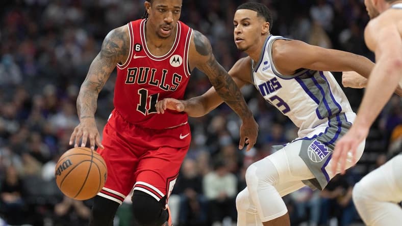 Dec 4, 2022; Sacramento, California, USA; Chicago Bulls forward DeMar DeRozan (11) drives around Sacramento Kings forward Keegan Murray (13) during the third quarter at Golden 1 Center. Mandatory Credit: Stan Szeto-USA TODAY Sports