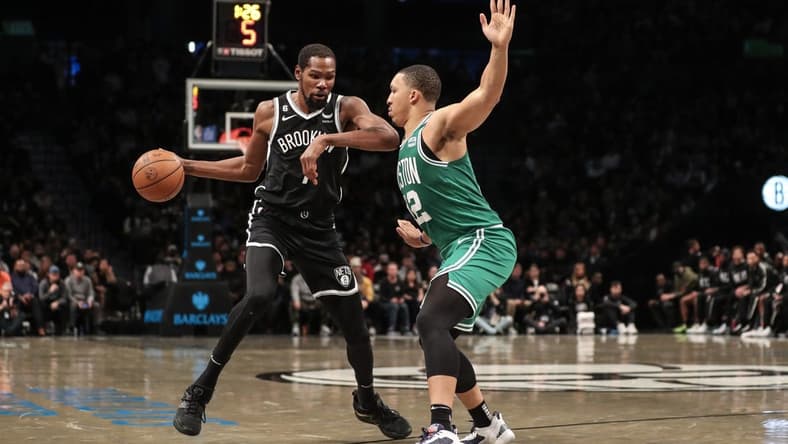 Dec 4, 2022; Brooklyn, New York, USA; Brooklyn Nets forward Kevin Durant (7) looks to drive past Boston Celtics forward Grant Williams (12) in the third quarter at Barclays Center. Mandatory Credit: Wendell Cruz-USA TODAY Sports