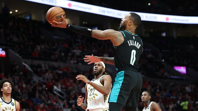 Dec 4, 2022; Portland, Oregon, USA; Portland Trail Blazers guard Damian Lillard (0) shoots the ball over Indiana Pacers in the first half at Moda Center. Mandatory Credit: Jaime Valdez-USA TODAY Sports