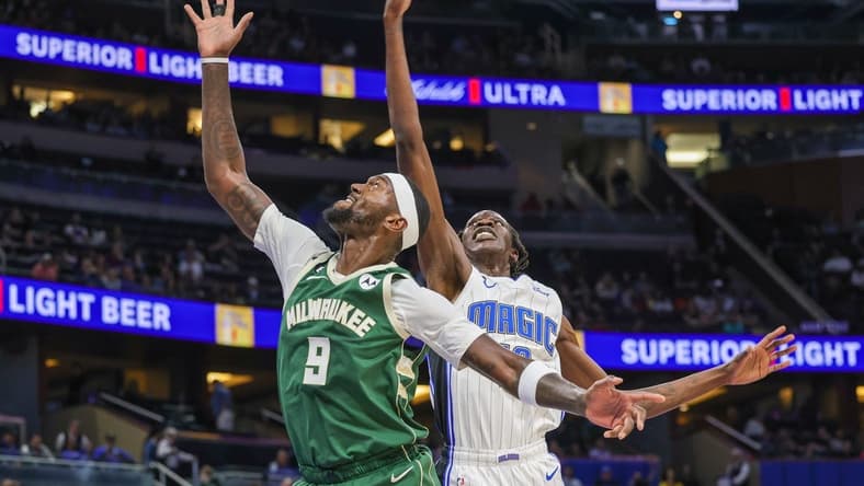 Dec 5, 2022; Orlando, Florida, USA; Milwaukee Bucks forward Bobby Portis (9) and Orlando Magic center Bol Bol (10) jump for the rebound during the second quarter at Amway Center. Mandatory Credit: Mike Watters-USA TODAY Sports