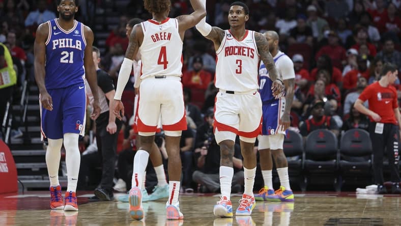 Dec 5, 2022; Houston, Texas, USA; Houston Rockets guard Kevin Porter Jr. (3) and guard Jalen Green (4) react after a play during the third quarter against the Philadelphia 76ers at Toyota Center. Mandatory Credit: Troy Taormina-USA TODAY Sports
