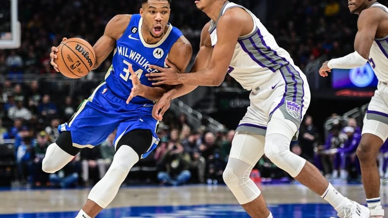 Dec 7, 2022; Milwaukee, Wisconsin, USA; Milwaukee Bucks forward Giannis Antetokounmpo (34) drives for the basket against Sacramento Kings forward Keegan Murray (13) in the first quarter at Fiserv Forum. Mandatory Credit: Benny Sieu-USA TODAY Sports