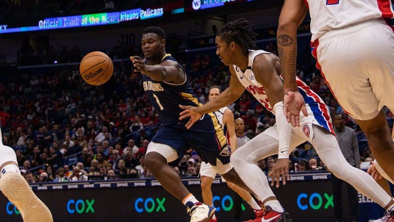Dec 7, 2022; New Orleans, Louisiana, USA; New Orleans Pelicans forward Zion Williamson (1) recovers a loose ball from Detroit Pistons guard Jaden Ivey (23) during the first half at Smoothie King Center. Mandatory Credit: Stephen Lew-USA TODAY Sports