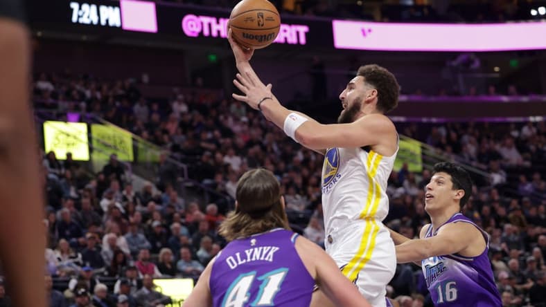 Dec 7, 2022; Salt Lake City, Utah, USA; Golden State Warriors guard Klay Thompson (11) attempts a shot during the first quarter against the Utah Jazz at Vivint Arena. Mandatory Credit: Chris Nicoll-USA TODAY Sports