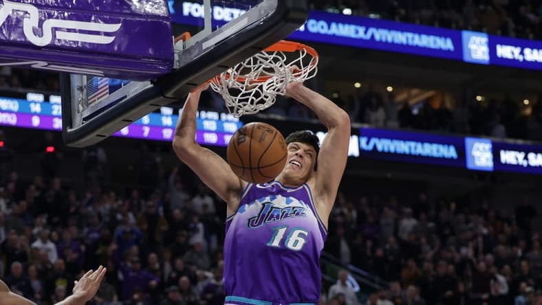 Dec 7, 2022; Salt Lake City, Utah, USA; Utah Jazz forward Simone Fontecchio (16) dunks the basketball to win the game 124-123 against the Golden State Warriors in the final seconds of the game at Vivint Arena. Mandatory Credit: Chris Nicoll-USA TODAY Sports