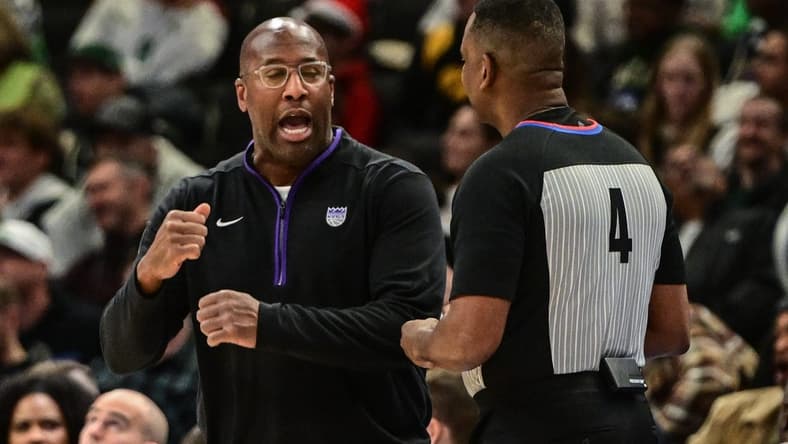 Dec 7, 2022; Milwaukee, Wisconsin, USA; Sacramento Kings head coach Mike Brown talks to referee Sean Wright in the third quarter at Fiserv Forum. Mandatory Credit: Benny Sieu-USA TODAY Sports