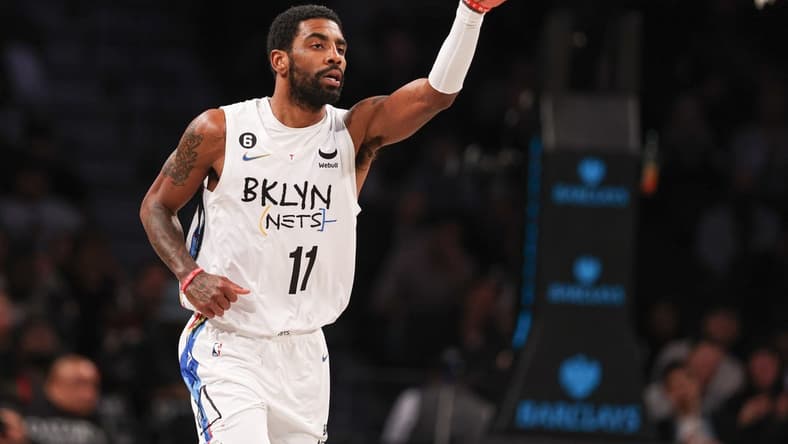 Dec 7, 2022; Brooklyn, New York, USA; Brooklyn Nets guard Kyrie Irving (11) reacts after a basket during the first quarter against the Charlotte Hornets at Barclays Center. Mandatory Credit: Vincent Carchietta-USA TODAY Sports