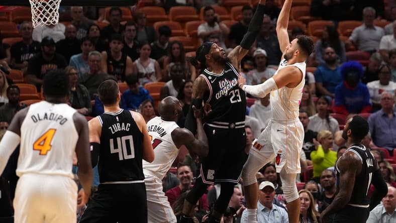Dec 8, 2022; Miami, Florida, USA; LA Clippers forward Robert Covington (23) blocks the shot of Miami Heat guard Max Strus (31) during the first half at FTX Arena. Mandatory Credit: Jasen Vinlove-USA TODAY Sports