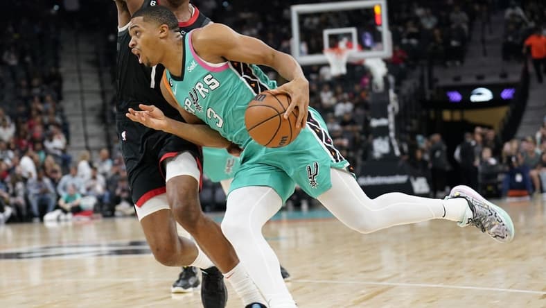 Dec 8, 2022; San Antonio, Texas, USA; San Antonio Spurs forward Keldon Johnson (3) drives to the basket during the first half against the Houston Rockets at AT&T Center. Mandatory Credit: Scott Wachter-USA TODAY Sports
