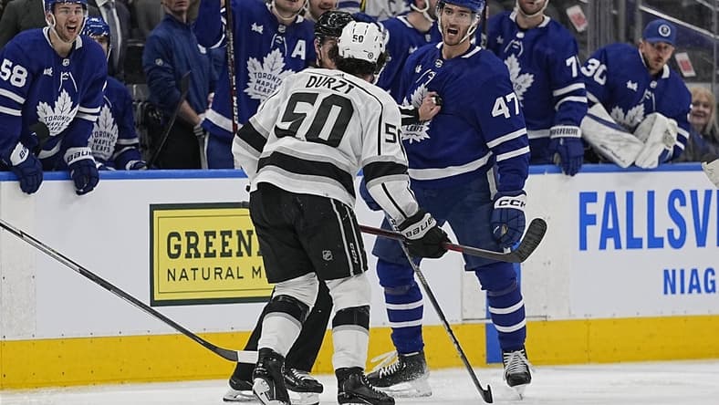 Dec 8, 2022; Toronto, Ontario, CAN; Toronto Maple Leafs forward Pierre Engvall (47) and Los Angeles Kings defenseman Sean Durzi (50) exchange words after a hit during the third period at Scotiabank Arena. Mandatory Credit: John E. Sokolowski-USA TODAY Sports