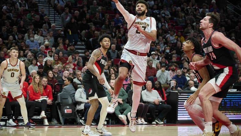 Dec 8, 2022; Portland, Oregon, USA; Denver Nuggets guard Jamal Murray (27) scores a layup during the second half against the Portland Trail Blazers at Moda Center. The Nuggets won the game 121-120. Mandatory Credit: Troy Wayrynen-USA TODAY Sports