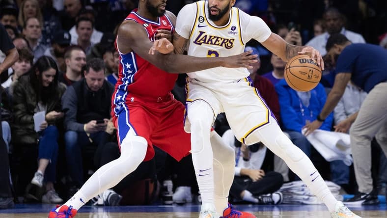 Dec 9, 2022; Philadelphia, Pennsylvania, USA; Los Angeles Lakers forward Anthony Davis (3) controls the ball against Philadelphia 76ers center Joel Embiid (21) during the first quarter at Wells Fargo Center. Mandatory Credit: Bill Streicher-USA TODAY Sports