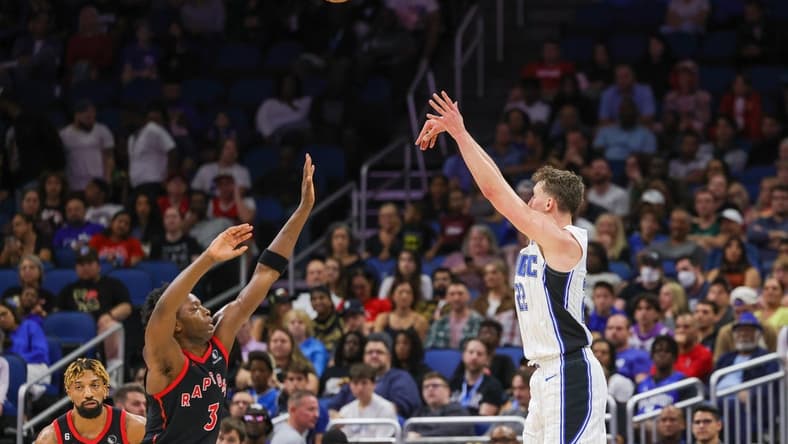 Dec 9, 2022; Orlando, Florida, USA; Orlando Magic forward Franz Wagner (22) shoots the ball over Toronto Raptors forward O.G. Anunoby (3) during the second quarter at Amway Center. Mandatory Credit: Mike Watters-USA TODAY Sports