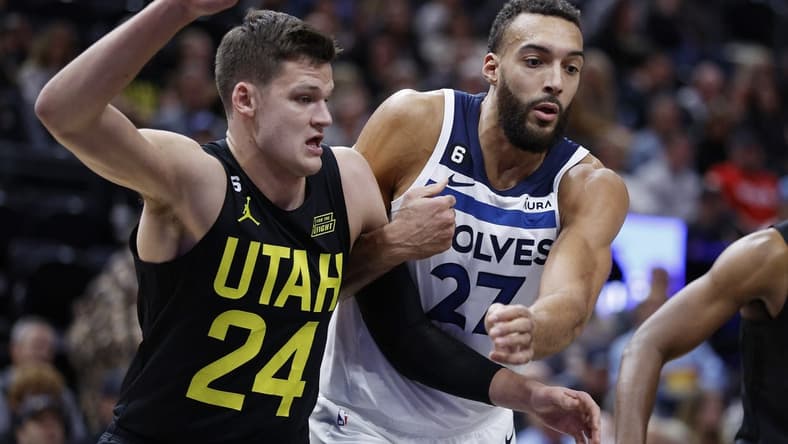 Dec 9, 2022; Salt Lake City, Utah, USA; Utah Jazz center Walker Kessler (24) and Minnesota Timberwolves center Rudy Gobert (27) battle in the first half at Vivint Arena. Mandatory Credit: Jeffrey Swinger-USA TODAY Sports