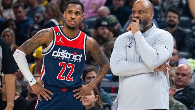 Dec 9, 2022; Indianapolis, Indiana, USA; Washington Wizards guard Monte Morris (22) and head coach Wes Unseld Jr. in the second half against the Indiana Pacers at Gainbridge Fieldhouse. Mandatory Credit: Trevor Ruszkowski-USA TODAY Sports