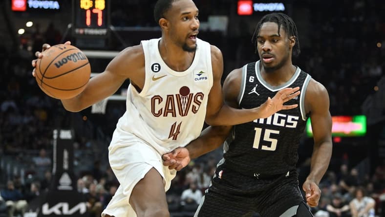 Dec 9, 2022; Cleveland, Ohio, USA; Cleveland Cavaliers forward Evan Mobley (4) drives to the basket against Sacramento Kings guard Davion Mitchell (15) during the second half at Rocket Mortgage FieldHouse. Mandatory Credit: Ken Blaze-USA TODAY Sports