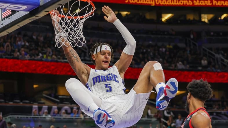 Dec 9, 2022; Orlando, Florida, USA; Orlando Magic forward Paolo Banchero (5) dunks the ball during the second half against the Toronto Raptors at Amway Center. Mandatory Credit: Mike Watters-USA TODAY Sports