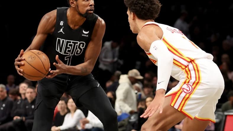 Dec 9, 2022; Brooklyn, New York, USA; Brooklyn Nets forward Kevin Durant (7) controls the ball against Atlanta Hawks forward Jalen Johnson (1) during the third quarter at Barclays Center. Mandatory Credit: Brad Penner-USA TODAY Sports
