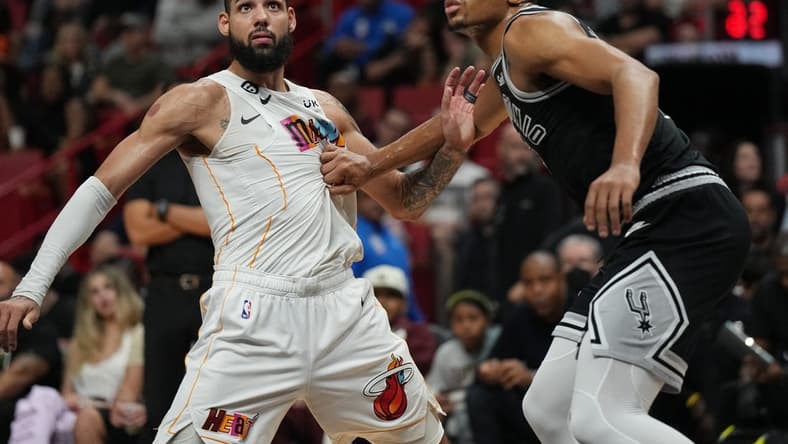 Dec 10, 2022; Miami, Florida, USA; Miami Heat forward Caleb Martin (16) and San Antonio Spurs forward Keldon Johnson (3) battle for position during the first half at FTX Arena. Mandatory Credit: Jim Rassol-USA TODAY Sports
