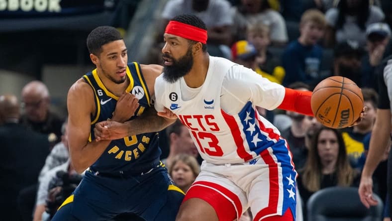 Dec 10, 2022; Indianapolis, Indiana, USA; Brooklyn Nets forward Markieff Morris (13) dribbles the ball against Indiana Pacers guard Tyrese Haliburton (0) in the first quarter at Gainbridge Fieldhouse. Mandatory Credit: Trevor Ruszkowski-USA TODAY Sports