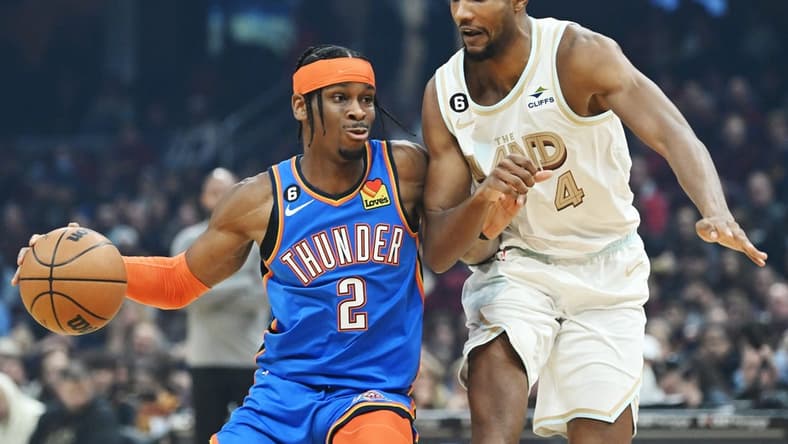 Dec 10, 2022; Cleveland, Ohio, USA; Oklahoma City Thunder guard Shai Gilgeous-Alexander (2) drives to the basket against Cleveland Cavaliers forward Evan Mobley (4) during the first half at Rocket Mortgage FieldHouse. Mandatory Credit: Ken Blaze-USA TODAY Sports