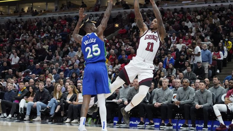 Dec 10, 2022; Chicago, Illinois, USA; Chicago Bulls forward DeMar DeRozan (11) shoots the ball over Dallas Mavericks forward Reggie Bullock (25) during the first quarter at United Center. Mandatory Credit: David Banks-USA TODAY Sports
