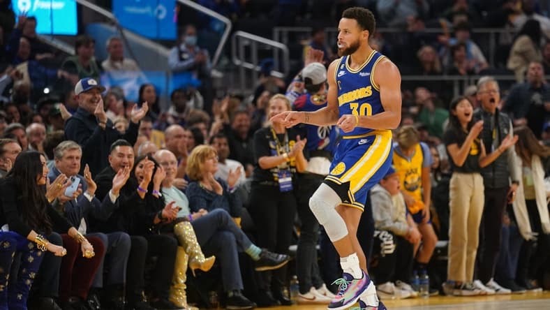 Dec 10, 2022; San Francisco, California, USA; Golden State Warriors guard Stephen Curry (30) celebrates after making a three point basket while being fouled against the Boston Celtics in the second quarter at the Chase Center. Mandatory Credit: Cary Edmondson-USA TODAY Sports