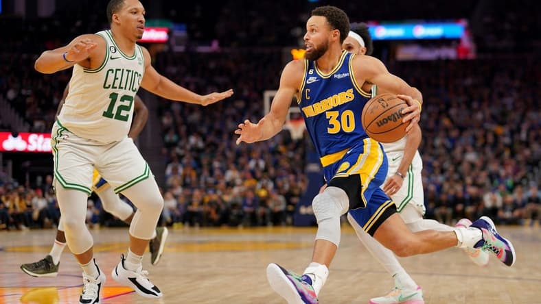 Dec 10, 2022; San Francisco, California, USA; Golden State Warriors guard Stephen Curry (30) dribbles the ball against Boston Celtics forward Grant Williams (12) in the fourth quarter at the Chase Center. Mandatory Credit: Cary Edmondson-USA TODAY Sports