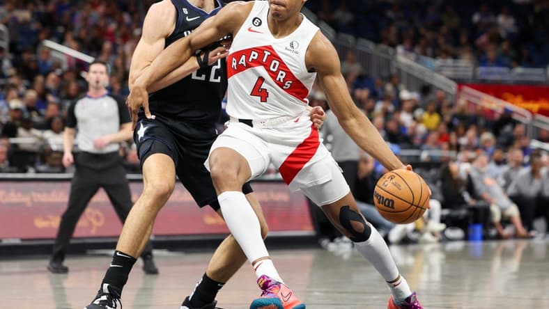 Dec 11, 2022; Orlando, Florida, USA; Toronto Raptors forward Scottie Barnes (4) drives to the basket past Orlando Magic forward Franz Wagner (22) in the first quarter at Amway Center. Mandatory Credit: Nathan Ray Seebeck-USA TODAY Sports