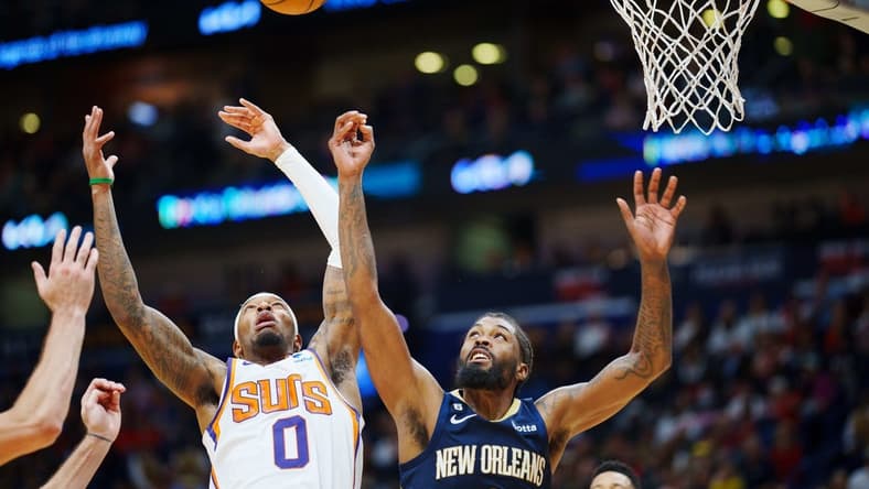 Dec 11, 2022; New Orleans, Louisiana, USA; New Orleans Pelicans forward Naji Marshall (8) and Phoenix Suns forward Torrey Craig (0) fight for a rebound during overtime at Smoothie King Center. Mandatory Credit: Andrew Wevers-USA TODAY Sports