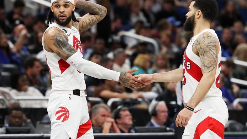 Dec 11, 2022; Orlando, Florida, USA; Toronto Raptors guard Fred VanVleet (23) and guard Gary Trent Jr. (33) react after a play against the Orlando Magic in the third quarter at Amway Center. Mandatory Credit: Nathan Ray Seebeck-USA TODAY Sports