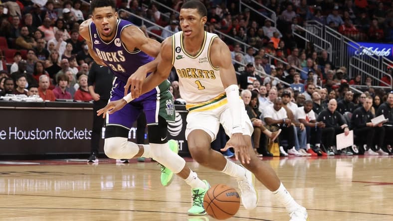 Dec 11, 2022; Houston, Texas, USA; Houston Rockets forward Jabari Smith Jr. (1) dribbles against Milwaukee Bucks forward Giannis Antetokounmpo (34) in the second half at Toyota Center. Mandatory Credit: Thomas B. Shea-USA TODAY Sports