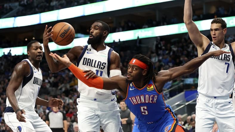 Dec 12, 2022; Dallas, Texas, USA; Oklahoma City Thunder forward Luguentz Dort (5) and Dallas Mavericks forward Tim Hardaway Jr. (11) go for a loose ball during the second quarter at American Airlines Center. Mandatory Credit: Kevin Jairaj-USA TODAY Sports