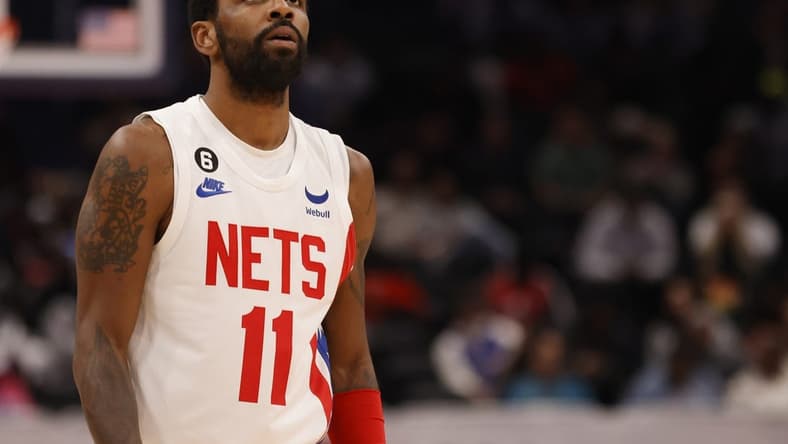 Dec 12, 2022; Washington, District of Columbia, USA; Brooklyn Nets guard Kyrie Irving (11) stands on the court against the Washington Wizards in the third quarter at Capital One Arena. Mandatory Credit: Geoff Burke-USA TODAY Sports
