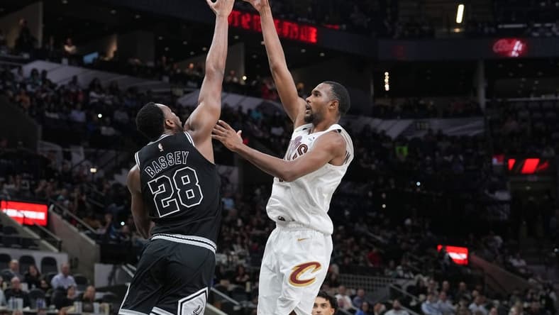 Dec 12, 2022; San Antonio, Texas, USA; Cleveland Cavaliers forward Evan Mobley (4) shoots over San Antonio Spurs center Charles Bassey (28) in the second half at the AT&T Center. Mandatory Credit: Daniel Dunn-USA TODAY Sports