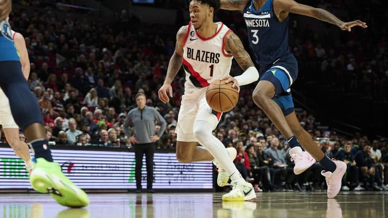 Dec 12, 2022; Portland, Oregon, USA; Portland Trail Blazers guard Anfernee Simons (1) drives to the basket during the first half against Minnesota Timberwolves forward Jaden McDaniels (3) at Moda Center. Mandatory Credit: Troy Wayrynen-USA TODAY Sports