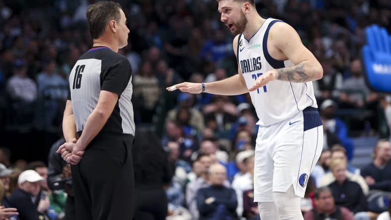 Dec 12, 2022; Dallas, Texas, USA; Dallas Mavericks guard Luka Doncic (77) speaks with referee David Guthrie (16) during the second half against the Oklahoma City Thunder at American Airlines Center. Mandatory Credit: Kevin Jairaj-USA TODAY Sports
