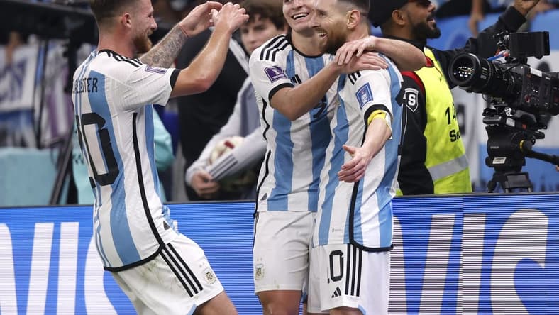 Dec 13, 2022; Lusail, Qatar; Argentina forward Julian Alvarez (9) celebrates with forward Lionel Messi (10) and midfielder Alexis Mac Allister (20) after scoring a goal against Croatia during the second half of a semifinal match during the 2022 World Cup at Lusail Stadium. Mandatory Credit: Yukihito Taguchi-USA TODAY Sports