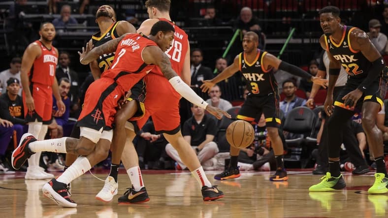 zDec 13, 2022; Houston, Texas, USA; Houston Rockets guard Kevin Porter Jr. (3) dribbles around Phoenix Suns forward Mikal Bridges (25) using center Alperen Sengun (28) as a pick in the first quarter at Toyota Center. Mandatory Credit: Thomas Shea-USA TODAY Sports