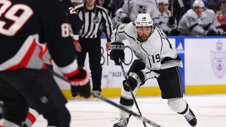 Dec 13, 2022; Buffalo, New York, USA; Los Angeles Kings left wing Alex Iafallo (19) skates up ice with the puck during the third period against the Buffalo Sabres at KeyBank Center. Mandatory Credit: Timothy T. Ludwig-USA TODAY Sports