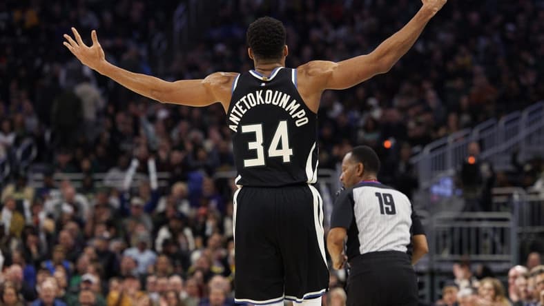 Dec 13, 2022; Milwaukee, Wisconsin, USA; Milwaukee Bucks forward Giannis Antetokounmpo (34) reacts after scoring a 3 point basket during the fourth quarter against the Golden State Warriors at Fiserv Forum. Mandatory Credit: Jeff Hanisch-USA TODAY Sports