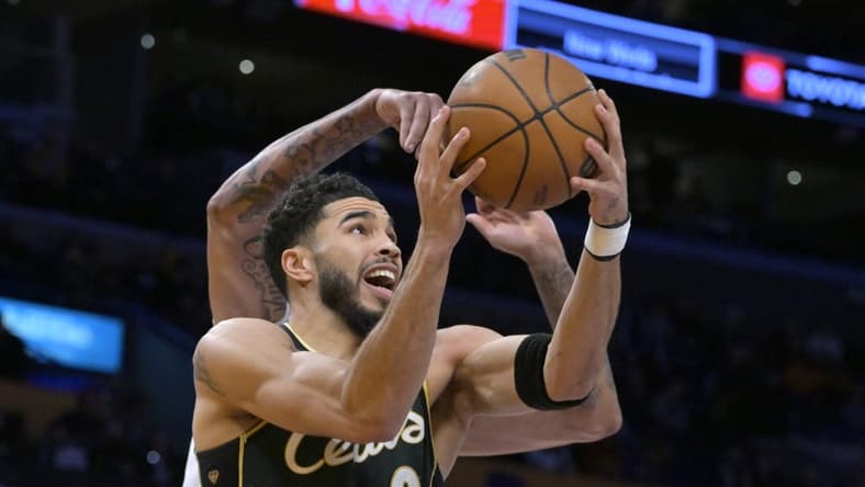 Dec 13, 2022; Los Angeles, California, USA; Boston Celtics forward Jayson Tatum (0) is defended by Los Angeles Lakers forward Anthony Davis (3) as he moves to the basket in the first half at Crypto.com Arena. Mandatory Credit: Jayne Kamin-Oncea-USA TODAY Sports