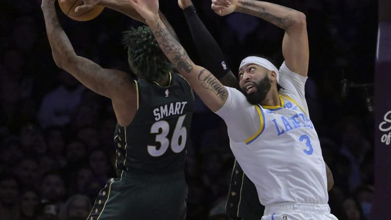 Dec 13, 2022; Los Angeles, California, USA; Boston Celtics guard Marcus Smart (36) and Los Angeles Lakers forward Anthony Davis (3) reach for a rebound in the first half at Crypto.com Arena. Mandatory Credit: Jayne Kamin-Oncea-USA TODAY Sports