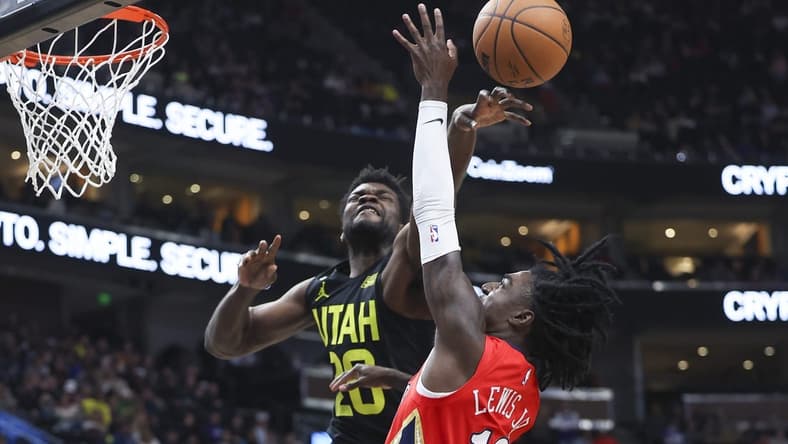 Dec 13, 2022; Salt Lake City, Utah, USA; Utah Jazz center Udoka Azubuike (20) blocks the shot of New Orleans Pelicans guard Kira Lewis Jr. (13) in the second half at Vivint Arena. Mandatory Credit: Rob Gray-USA TODAY Sports