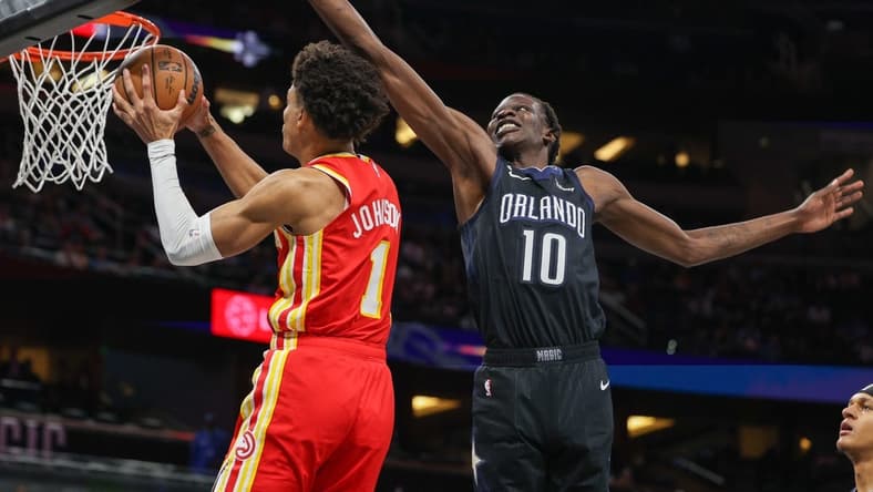 Dec 14, 2022; Orlando, Florida, USA;  Atlanta Hawks forward Jalen Johnson (1) dunks the ball past Orlando Magic center Bol Bol (10) in the first quarter at Amway Center. Mandatory Credit: Nathan Ray Seebeck-USA TODAY Sports