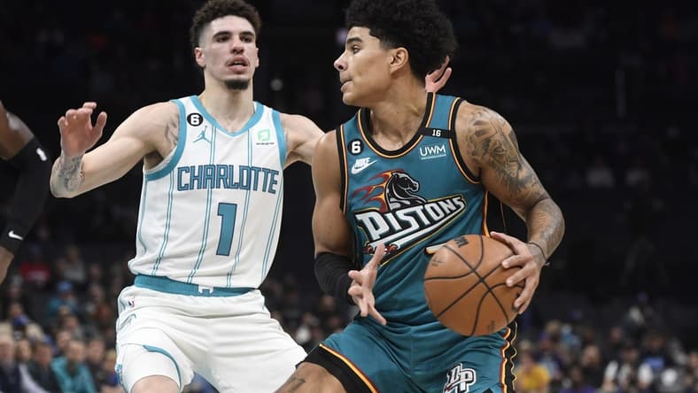 Dec 14, 2022; Charlotte, North Carolina, USA; Detroit Pistons guard Killian Hayes (7) looks to shoot as he is defended by Charlotte Hornets guard LaMelo Ball (1) during the first half at the Spectrum Center. Mandatory Credit: Sam Sharpe-USA TODAY Sports