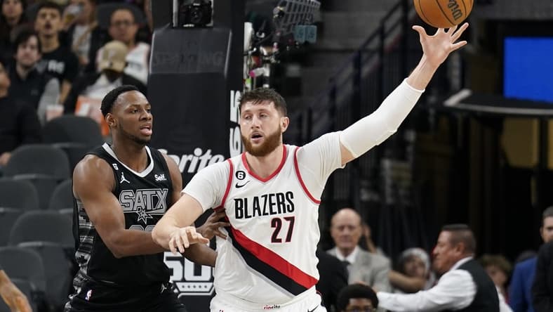 Dec 14, 2022; San Antonio, Texas, USA; Portland Trailblazers center Jusuf Nurkic (27) catches a pass while defended by during the first half against the San Antonio Spurs center Charles Bassey (23) during the first half at AT&T Center. Mandatory Credit: Scott Wachter-USA TODAY Sports