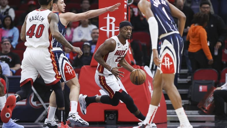 Dec 15, 2022; Houston, Texas, USA; Miami Heat forward Jimmy Butler (22) dribbles the ball during the first quarter against the Houston Rockets at Toyota Center. Mandatory Credit: Troy Taormina-USA TODAY Sports
