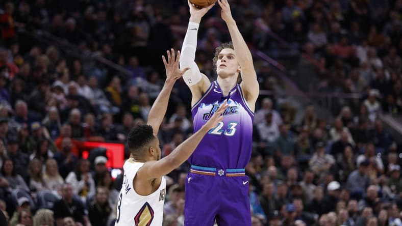 Dec 15, 2022; Salt Lake City, Utah, USA; Utah Jazz forward Lauri Markkanen (23) shoots over -New Orleans Pelicans guard CJ McCollum (3) in the first half at Vivint Arena. Mandatory Credit: Jeffrey Swinger-USA TODAY Sports